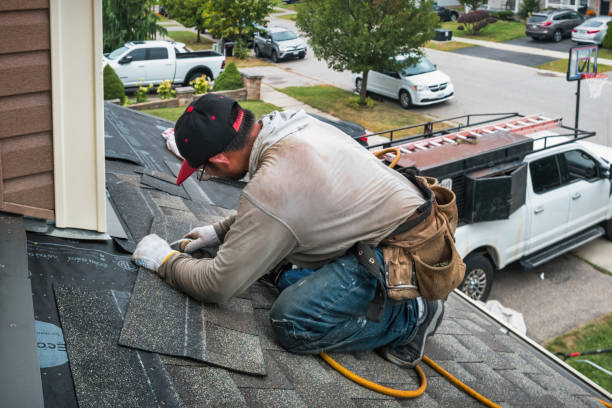 Professional Roofing technician working in Mantoloking, NJ